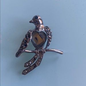 Silver bird brooch with rhinestones
